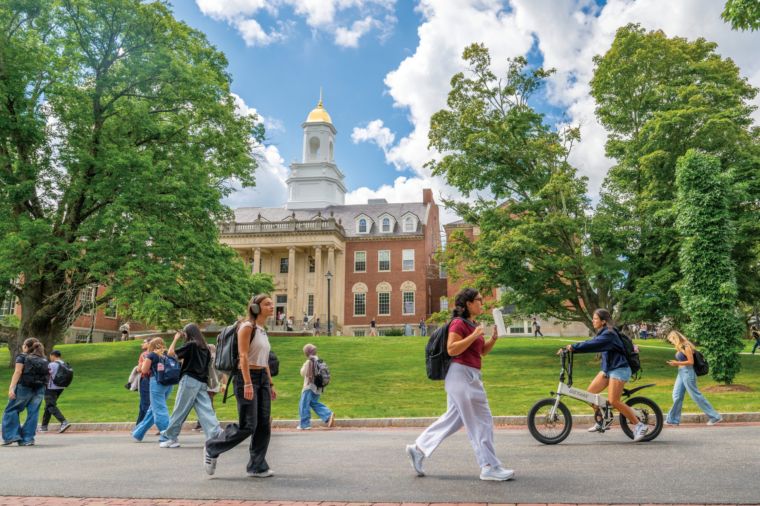 Students walking along the pathway in front of Wilbur Cross on August 27, 2025.